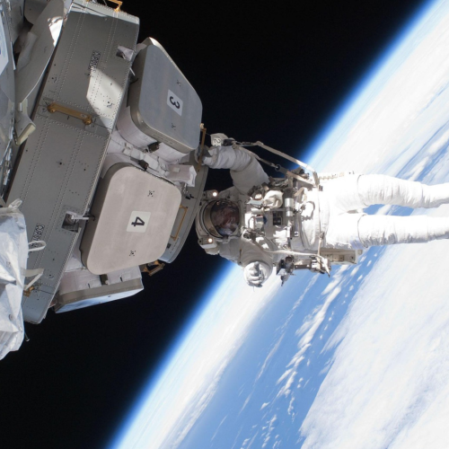 Astronaut coming out of a spacecraft by NASA